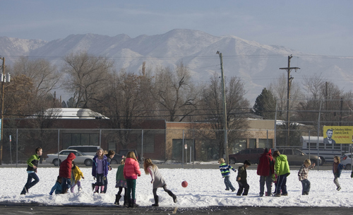 Keith Johnson |  Tribune file photo

Inversion partially obscures the Wasatch Mountains as Hawthorne Elementary School students enjoy recess, December 17, 2013, in Salt Lake City.
