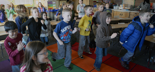 Al Hartmann  |  The Salt Lake Tribune
Second-graders in Angie Leone's classroom at Hawthorne Elementary bounce and jiggle to a music video during a quick morning break from study. These short bursts of guided exercise and dance, "brain breaks," combat obesity and boost academic performance. Itís also a go-to strategy on bad air days when pollution-trapping winter inversions make it unhealthy for children to go outside for recess.