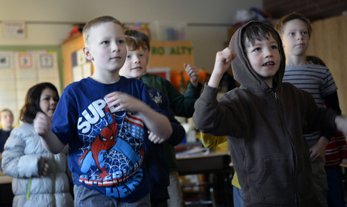 Al Hartmann  |  The Salt Lake Tribune
Second-graders in Angie Leone's classroom at Hawthorne Elementary bounce and jiggle to a music video during a quick morning break from study  These short bursts of guided exercise and dance, "brain breaks," combat obesity and boost academic performance. It's also a go-to strategy on bad air days when pollution-trapping winter inversions make it unhealthy for children to go outside for recess.