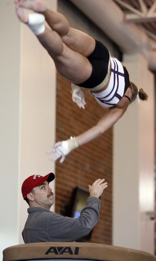 Trent Nelson   |  Tribune file photo
Utah gymnastics coach Greg Marsden spots Nicolle Ford on the vault.