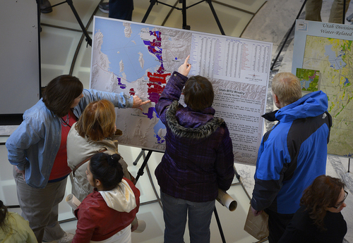 Scott Sommerdorf   |  The Salt Lake Tribune
Visitors to the Utah Capitol building look over a map that charts the Utah-BYU rivalry by listing each city's loyalty during "Maps on the Hill" day, Wednesday, Jan. 29, 2014.