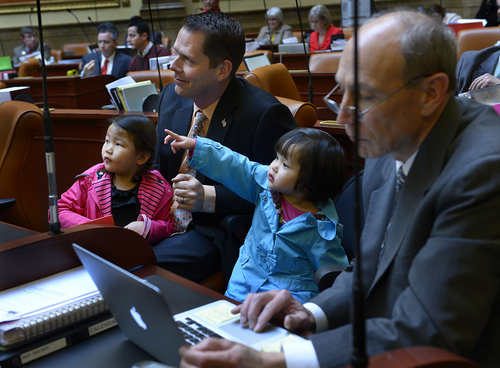 Scott Sommerdorf   |  The Salt Lake Tribune
Rep. Jacob Anderegg, R-Lehi, sits with his two adopted daughters, Lizzie, 4, and Ellie, 3, in the Utah House of Representatives, Wednesday, Jan. 29, 2014. Later Anderegg made an emotional introduction to the House of Ellie, who was just adopted from China.