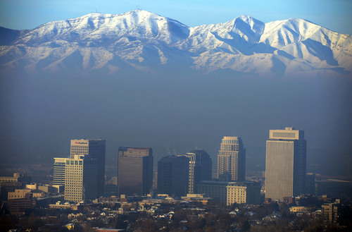 Steve Griffin  |  The Salt Lake Tribune
The sunrise illuminates the peaks of the Oquirrh Mountains as a the inversion blankets the Salt Lake Valley in Salt Lake City, Utah Monday, December 16, 2013. A Salt Lake Tribune poll has found that a majority of Utahns want stricter air quality standards.