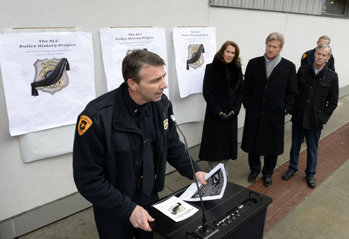 Francisco Kjolseth  |  The Salt Lake Tribune
Lt. Mike Ross with the Salt Lake police department gives a little back history during a ceremony to recognize three officers killed in the line of duty. Harmons City Creek agreed to host the bronze plaques on the 100 South entrance to its downtown store, across the street from which the three were killed in separate events in 1858, 1894 and 1951.