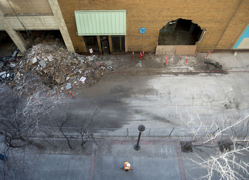 Steve Griffin  |  The Salt Lake Tribune

A hole has been punched in an exterior wall at the old printing press building on Regent Street between 100 South and 200 South in Salt Lake City, Tuesday, January 28, 2014. Demolition continues on the block to make room for the new Utah Performing Arts Center.