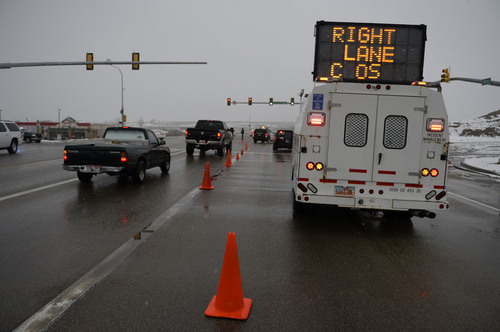 Francisco Kjolseth  |  The Salt Lake Tribune
Police officers direct traffic off of SR 73 at Ranches Parkway near Eagle Mountain on Thursday, Jan. 30, 2014, following an officer shooting incident further West.
