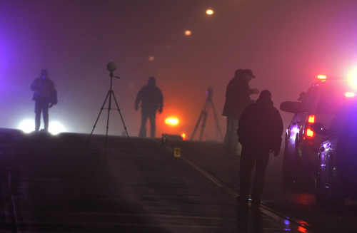 Keith Johnson | The Salt Lake Tribune

Law enforcement agents investigate a crime scene in Santaquin, Utah related to an officer-involved shooting, January 31, 2014.