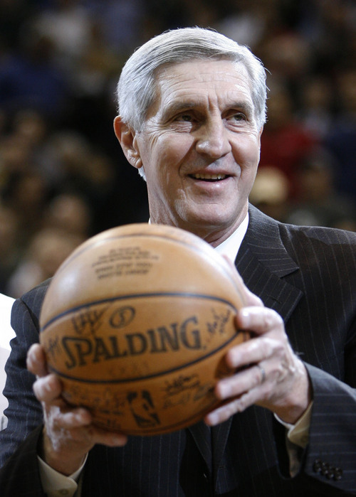 Steve Griffin  |  The Salt Lake Tribune

Utah Jazz head coach Jerry Sloan holds up the game ball from his 1000 victory as he is honored for the achievement prior to the start of the Utah Jazz Milwaukee Bucks game at the EnergySolutions Arena Wednesday  November 19, 2008.