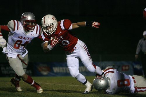 Chris Detrick  |  The Salt Lake Tribune
East's Preston Curtis (10) is tackled by Bountiful's Taylor Gulbransen (84) and Bountiful's Tanner Smith (8) during the game at East High School Thursday October 17, 2013. East is winning the game 42-7 in the third quarter.