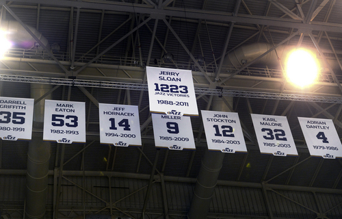 Scott Sommerdorf   |  The Salt Lake Tribune
The banner honoring former Jazz coach Jerry Sloan and his 1,223 victories takes it's place in the rafters after he was honored at halftime of the Utah Jazz vs Golden State Warriors game, Friday, Jan. 31, 2014.