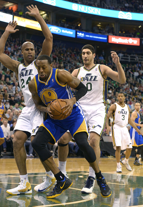 Scott Sommerdorf   |  The Salt Lake Tribune
Jazz players Richard jefferson and Enes Kanter defend against Golden State's Andre Iguodala during first period play as t he Jazz hosted the Golden State Warriors, Friday, Jan. 31, 2014.