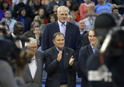 Scott Sommerdorf   |  The Salt Lake Tribune
Utah Governor Gary Herbert applauds as he is towered over by former Jazz player Mark Eaton as former Jazz coach Jerry Sloan is honored at halftime of the Utah Jazz vs Golden State Warriors game, Friday, Jan. 31, 2014.