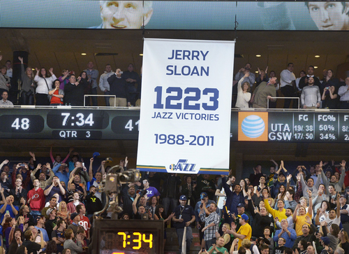 Scott Sommerdorf   |  The Salt Lake Tribune
Fans applaud as the banner is hoisted to the rafters honoring former Jazz coach Jerry Sloan and his number of victories during halftime as the Jazz hosted the Golden State Warriors, Friday, Jan. 31, 2014.