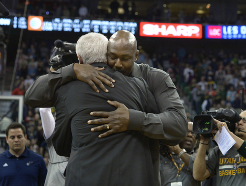 Scott Sommerdorf   |  The Salt Lake Tribune
Jazz great Karl Malone hugs his former coach Jerry Sloan after he spoke to the crowd and told Sloan how much he loved him, during halftime as the Jazz hosted the Golden State Warriors, Friday, Jan. 31, 2014.