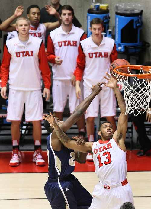 Scott Sommerdorf   |  The Salt Lake Tribune
Utah Utes guard Ahmad Fields (13) is fouled by UC Davis Aggies guard Avery Johnson (20) as they battle for a rebound during second half play. Utah defeated UC Davis 94-60, Friday, November 15, 2013 in Salt Lake City, Utah.