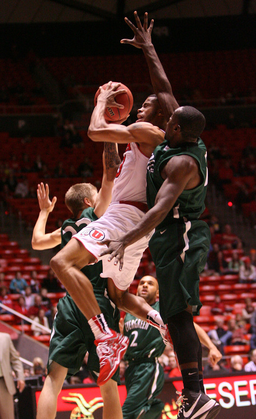 Leah Hogsten  |  The Salt Lake Tribune
Utah Utes guard Ahmad Fields (13) is fouled by Evergreen's Alex Howard (left) and pressured by Cameron Faison (right). University of Utah leads Evergreen College 72-22 in the 2nd half, Friday, November 8, 2013 at the Huntsman Center.