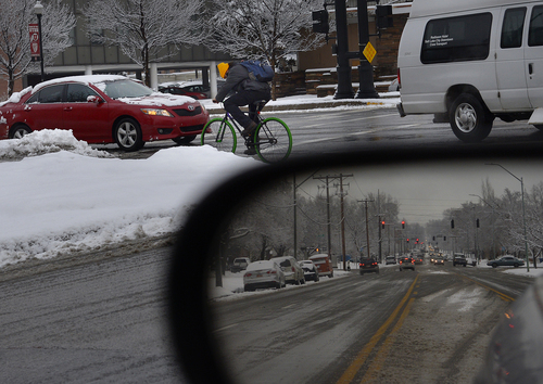 Scott Sommerdorf   |  The Salt Lake Tribune
Data shows that there have been hundreds of auto-bike collisions in Salt Lake in the last few years. A bicyclist navigates busy 400 South on Thursday, January 9, 2014 as a cross street is reflected in a car's mirror.