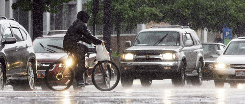 Steve Griffin | The Salt Lake Tribune


A biker gets caught in an afternoon rain shower as it whips through downtown Salt Lake City, Utah Tuesday May 28, 2013.