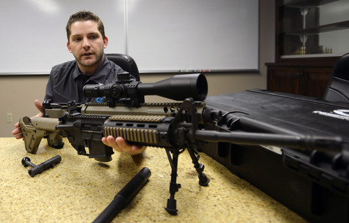 Steve Griffin  |  The Salt Lake Tribune

Seth Ercanbrack, marketing manager for Desert Tech in West Valley City, Utah, with a Hard Target Interdiction (HTI) sniper rifle at the company's offices Friday, January 31, 2014. Desert Tech is a Utah gun manufacturer developing one of the more accurate military rifles on the market.