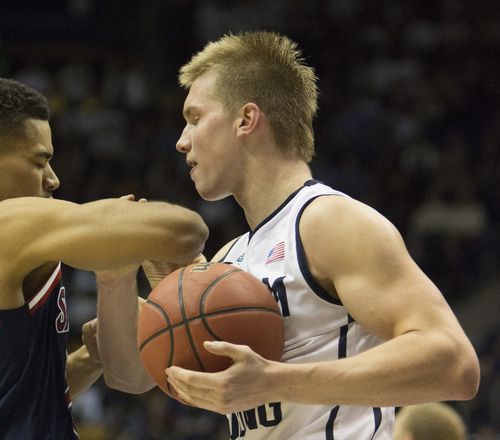 Ari Davis  | Special toThe Salt Lake Tribune 

St. Mary's Gaels forward Garrett Jackson (22) throws an elbow at Brigham Young Cougars guard Eric Mika (00), in basketball action, BYU vs. St Mary's, at the Marriott Center, Saturday, February 1, 2014. Jackson was ejected from the game for a Flagrant Foul 2.