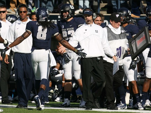 Leah Hogsten  |  The Salt Lake Tribune
Utah State Aggies wide receiver Travis Reynolds (8) is congratulated by Utah State Aggies head coach Matt Wells.  Utah State University hosts Hawaii at Romney Stadium, Saturday, November 2, 2013.