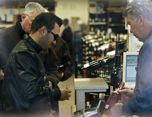 Lennie Mahler  |  The Salt Lake Tribune
Erick Callejas purchases a bottle of 12-year Old Rip Van Winkle bourbon at the state wine store in downtown Salt Lake City, Thursday, Feb. 6, 2014.
