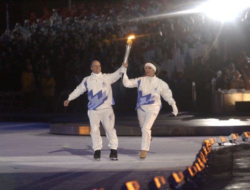 Rick Egan  |   Tribune file photo

Scott Hamilton and Peggy Fleming skate with the torch as it enters Rice-Eccles Stadium on Feb. 8, 2002.