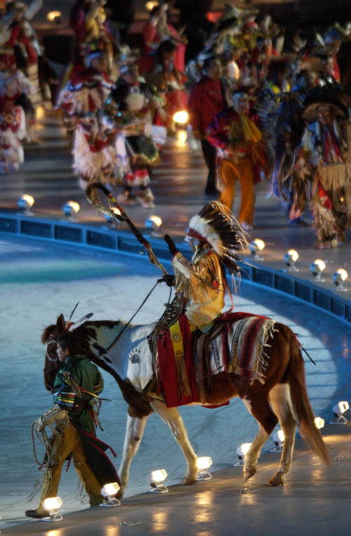 |  Tribune file photo

A man dressed in Native American garb performs during the Opening Ceremony.