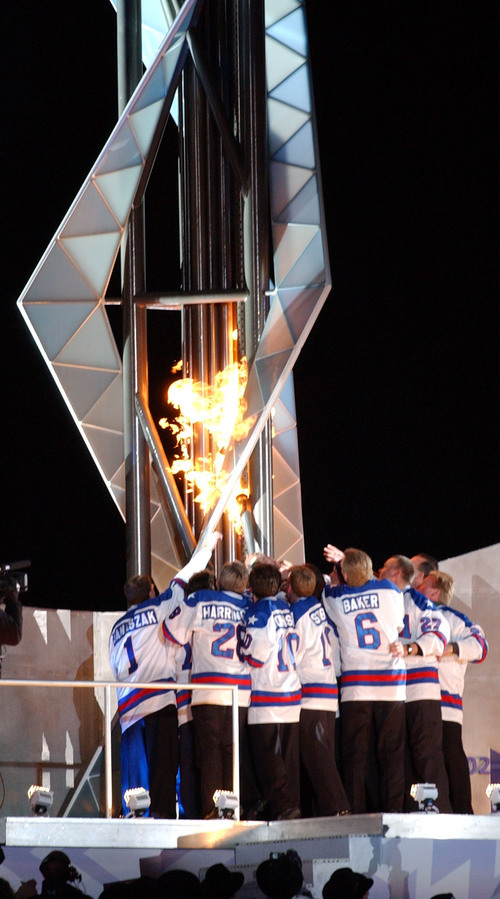 Danny Chan La  |  Tribune file photo

The 1980 USA Olympic Hockey Team lights the Olympic Cauldron during the Opening Ceremony.