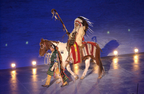 |  Tribune file photo

A rider dressed in Native American garb performs in the Opening Ceremony.