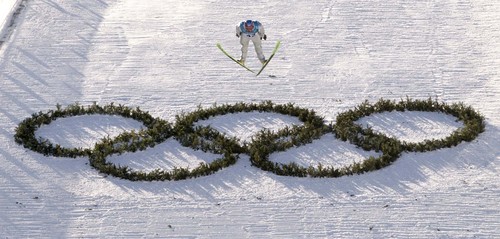 |  Tribune file photo

American Todd Lodwick flies over the Olympic rings in the final round of the Nordic Combined K90 ski jump in Park City, Utah during the 2002 Olympic Winter Games.