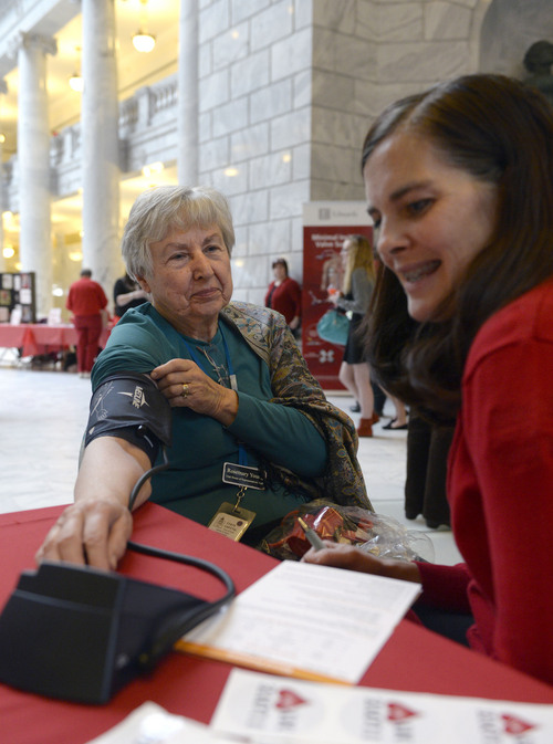 Al Hartmann  |  The Salt Lake Tribune 
Rosemary Young, a secretary in the Utah House of Representatives, has her blood pressure checked by Aly Pearson of the Jordan Valley Medical Center in the Capitol Rotunda on Friday, February 7, 2014. The public and legislators were offered free medical tests as part of  "Heart on the Hill" events at the Utah Legislature, during American Heart Month.