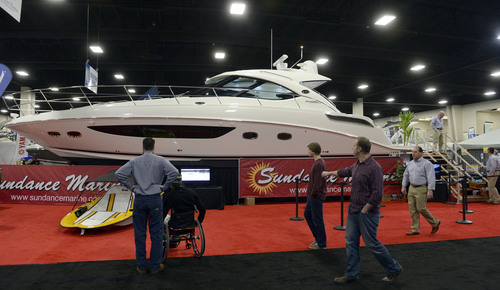 Francisco Kjolseth  |  The Salt Lake Tribune
Claiming the title as the longest boat in the room, a 47ft Sea Ray by Sundance Marine is accompanied by the smallest, the battery or solar powered Go Float, below left. For the price tag of $1,160,000, the friendly folks of Sundance Marine say they would cut you a great deal on one or two of the little boats, as the 60th annual Utah Boat Show gets underway at the South Towne Expo Center in Sandy on Thursday, Feb. 6, 2014.