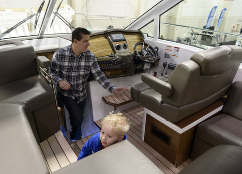 Francisco Kjolseth  |  The Salt Lake Tribune
Kevin Wilding of North Salt Lake and his son Isaac, 6, have fun exploring a 45ft Cantius by Cruiser Yats coming in at $950,000 during the 60th annual Utah Boat Show at the South Towne Expo Center in Sandy on Thursday, Feb. 6, 2014.