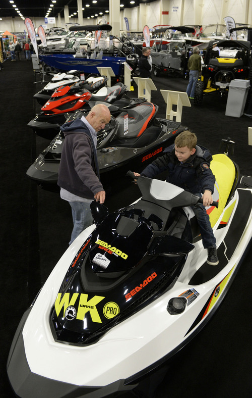 Francisco Kjolseth  |  The Salt Lake Tribune
Richard Obermark of Sandy and his grandson James, 6, have some fun checking out the jet skis during the 60th annual Utah Boat Show as it gets underway with vendors displaying the latest wares at the South Towne Expo Center in Sandy on Thursday, Feb. 6, 2014.