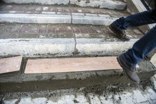 Chris Detrick |  The Salt Lake Tribune

A man walks past newly poured cement steps at the Gorky Gorod hotel complex in the Mountain Cluster in Krasnaya Polyana, Russia, before the start of the 2014 Sochi Olympics Wednesday February 5, 2014