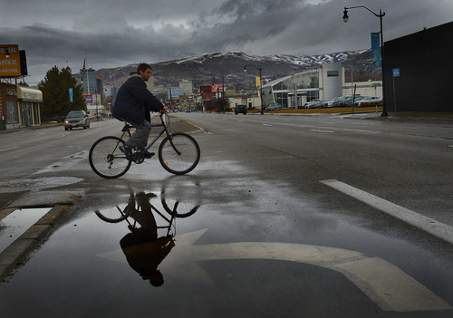 Scott Sommerdorf   |  The Salt Lake Tribune
Rain pooled in turn lanes on State Street, Sunday, Feb. 9, 2014.