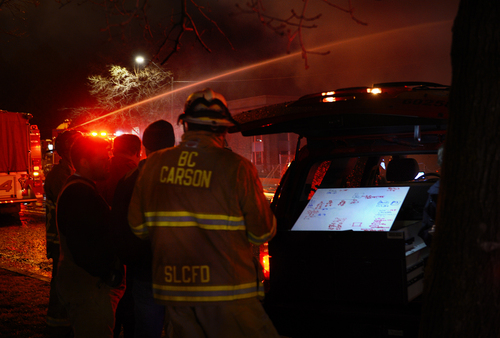 Scott Sommerdorf   |  The Salt Lake Tribune
Fire captains at a command center north of the fire kept track of assets working a four-alarm fire at a building under construction at 550 E, 500 S in Salt Lake City, Sunday, Feb. 9, 2014.