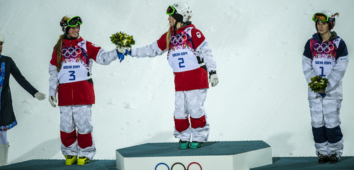 Chris Detrick  |  The Salt Lake Tribune
Justine Dufour-Lapointe, of Canada, her sister Chloe Dufour-Lapointe, and Hannah Kearney, of USA, celebrate after the Ladies' Moguls Finals at Rosa Khutor Extreme Park during the 2014 Sochi Olympic Games Saturday February 8, 2014. Justine Dufour-Lapointe won gold with a score of 22.44. Her sister Chloe Dufour-Lapointe won the silver with a score of 21.66. Hannah Kearney, of USA, won bronze with a score of 21.49.