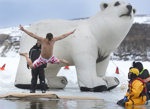 Scott Sommerdorf   |  The Salt Lake Tribune
Jeff Boulware makes the most of his leap into the waters of Hyrum Reservoir. Participants in the Polar Plunge raised funds for Utah Special Olympics by jumping into the freezing water of the Hyrum reservoir, in Hyrum, Saturday, Feb. 8, 2014.