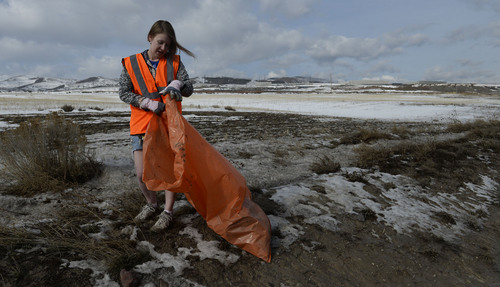 Francisco Kjolseth  |  The Salt Lake Tribune
Volunteer Halina Dobson of Murray joins Restore The Fourth-Utah along with other volunteers who share their concerns of the NSA as they pick up trash along Redwood Road in Bluffdale outside the Utah Data Center, in background, on Tuesday, Feb. 11, 2014. The clean up is meant to double as a protest against the NSA.
