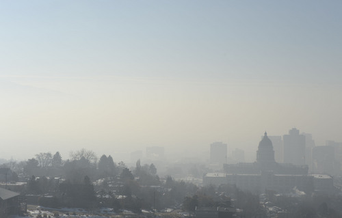 Francisco Kjolseth  |  The Salt Lake Tribune
The pollution-plagued Salt Lake Valley is obscured by another red air day as they inversion continues on Wednesday, Jan. 22, 2014. A weak storm predicted for Thursday could bring a little relief but is not expected to last.