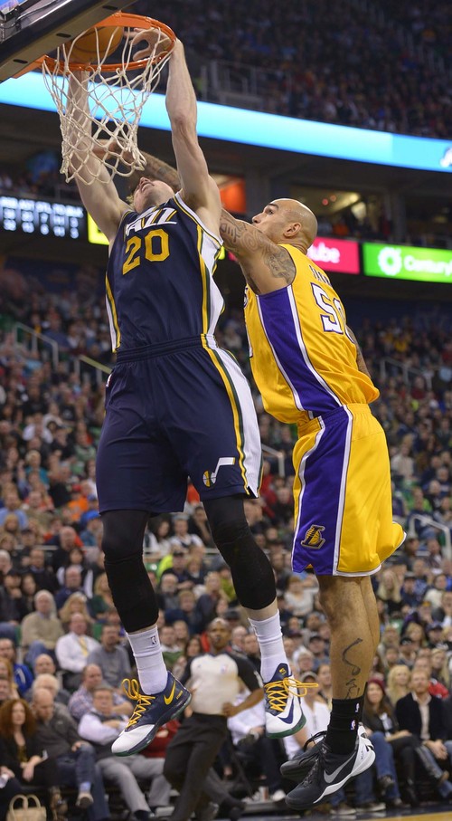 Leah Hogsten  |  The Salt Lake Tribune
Utah Jazz shooting guard Gordon Hayward (20) dunks and is fouled by Los Angeles Lakers center Robert Sacre (50). The Utah Jazz defeated the LA Lakers 105-103, Friday, December 27, 2013 at Energy Solutions Arena in Salt Lake City.