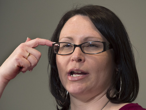 Steve Griffin  |  The Salt Lake Tribune


Gina Sherwood – wife of injured Utah County Sheriff's Deputy Greg Sherwood – points to her head to show where a bullet entered her husband's skull, as she talks to the media during a press conference to share information about her husband's condition and recovery at the Utah Valley Regional Medical Center  in Provo, Utah Monday, February 10, 2014.
