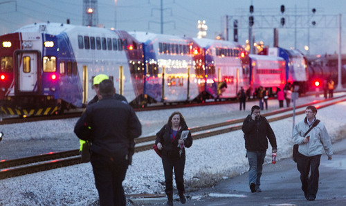 Steve Griffin  |  The Salt Lake Tribune


Passengers on a FrontRunner train that struck a truck stopped on the tracks at an intersection at 1800 N. and Warm Springs Road in Salt Lake City, Utah are allowed to walk away from the train Thursday, February 13, 2014. Many of the 300 passengers were loaded on UTA busses that took them to their destination. Others arranged their own transportation from the scene. The train was headed from Salt Lake City to Ogden, Utah. The driver of the truck was taken to a local hospital and according to authorities is listed in stable condition.