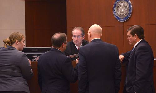 Leah Hogsten  |  The Salt Lake Tribune
L-r Defense attorneys Haylee Mills, Randall Marshall, Deputy Weber County prosecuting attorney  Chris Saw ad Weber County Attorney Dee Smith speak with Judge Scott Hadley (center) Wednesday, February 12, 2014 in the trial for Eric Millerberg, accused in the 2011 drug-related death of his children's 16-year-old baby sitter. Millerberg, 38, of North Ogden, is charged with first-degree felony child-abuse homicide in the September 2011 death of Alexis "Lexi" Rasmussen. He also is charged with felony counts of obstructing justice, desecrating a body and having unlawful sexual activity with a minor.
