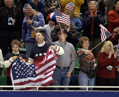 Trent Nelson  |  Tribune file photo
Figure skating fans wave flags during competition on Thursday, Feb. 14, 2002.