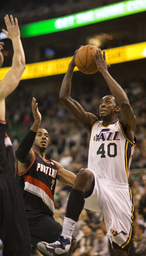 Lennie Mahler  |  The Salt Lake Tribune
Jeremy Evans elevates to attempt a dunk as the Jazz face the Blazers at EnergySolutions Arena on Wednesday, Oct. 16, 2013.