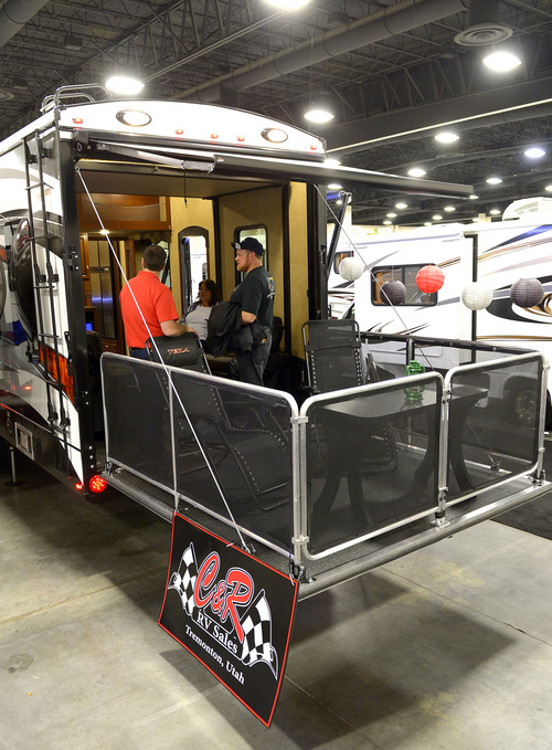 Leah Hogsten  |  The Salt Lake Tribune
A "Tesla" 5th wheel made by Evergreen offers an elevated deck patio for $74,000. The Utah Sportsmen's, Vacation & RV Show has plenty of eye-catching interests including RV's, trucks, ATV's, outdoor recreation equipment, RV accessories and dog agility demonstrations, cooking demos, a fly tie theater and Dutch oven cooking demos, Thursday, February 13-16, 2014  at the South Towne Expo Center.