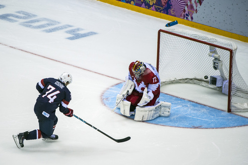 SOCHI, RUSSIA  - JANUARY 15:
United States' T.J. Oshie shoots past Russia's Sergei Bobrovski (72) during an overtime shootout against Russia at Bolshoy Ice Dome during the 2014 Sochi Olympics Saturday February 15, 2014. The United States men's hockey team defeated Russia with a 3-2 overtime victory.
(Photo by Chris Detrick/The Salt Lake Tribune)